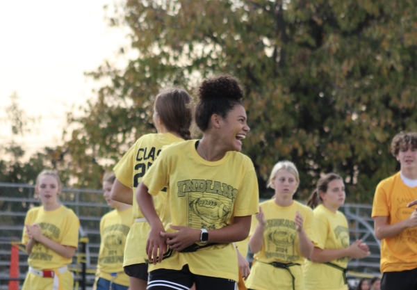 ALL SMILES! Sophia Lewis ('27) looks to her sophomore teammates after throwing a pass to score the first touchdown of the night. "We came to win and my friends and I did just that," Lewis said.